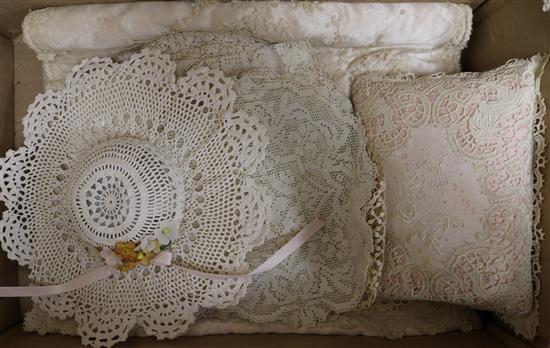 A collection of lace mats, nightie caes etc.